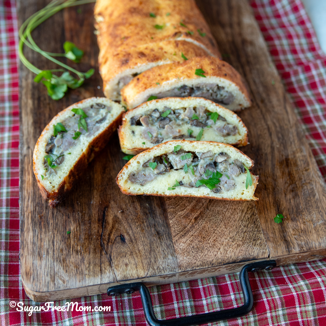 This amazing keto fathead dough is almond flour free and makes the best low carb calzone that's stuffed with breakfast sausage cheese and egg! 