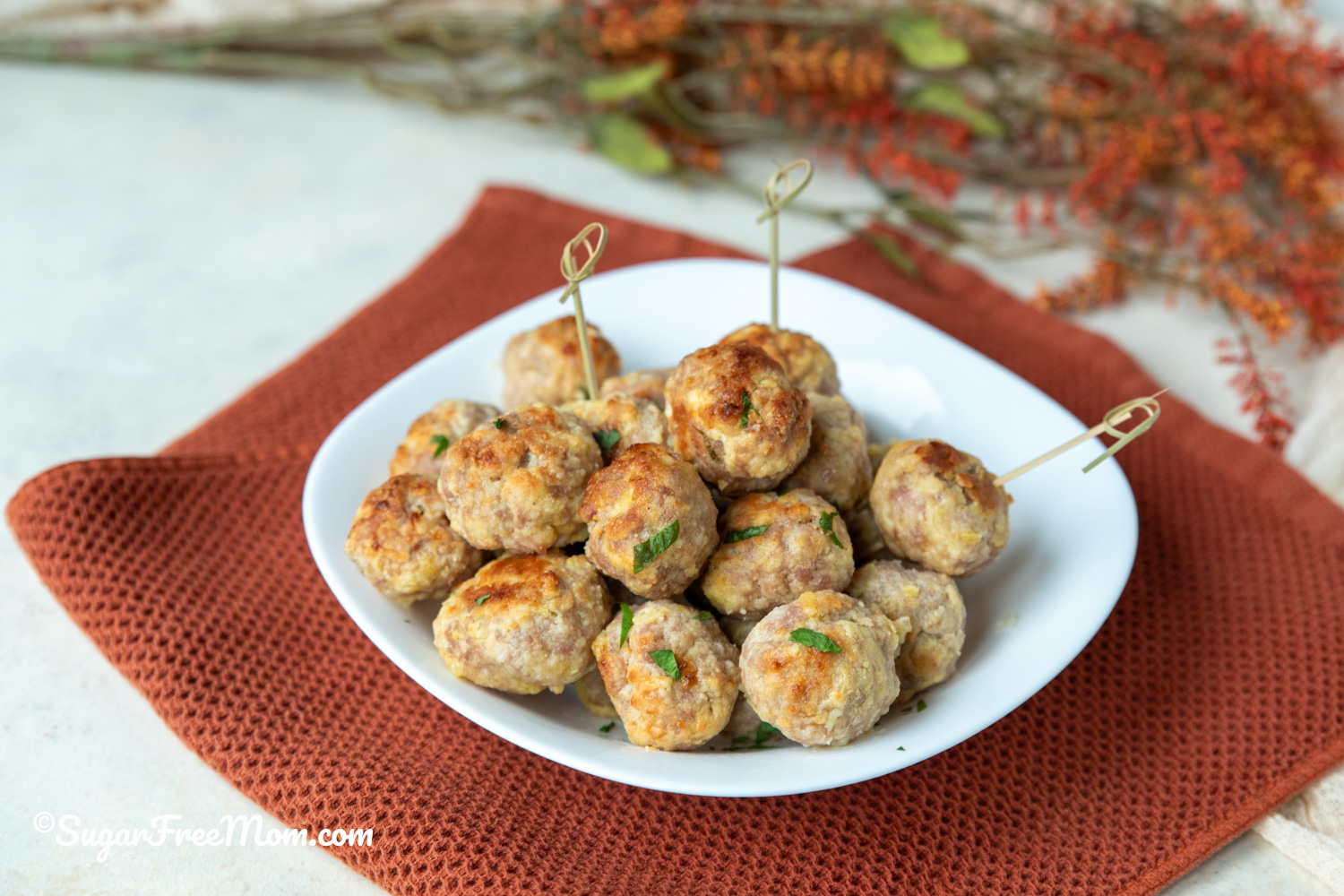 These cheesy keto low-carb sausage balls are the perfect appetizer for game day or anytime you need a quick easy recipe the whole family will love that's high in protein!