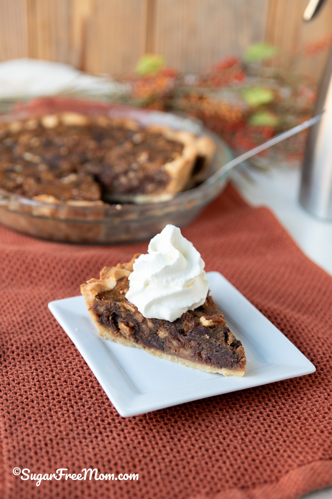 This easy keto Kentucky derby pie has a delicious gooey chocolate pecan filling baked in a flaky easy keto pie crust. Just 4 g net carbs per serving! 