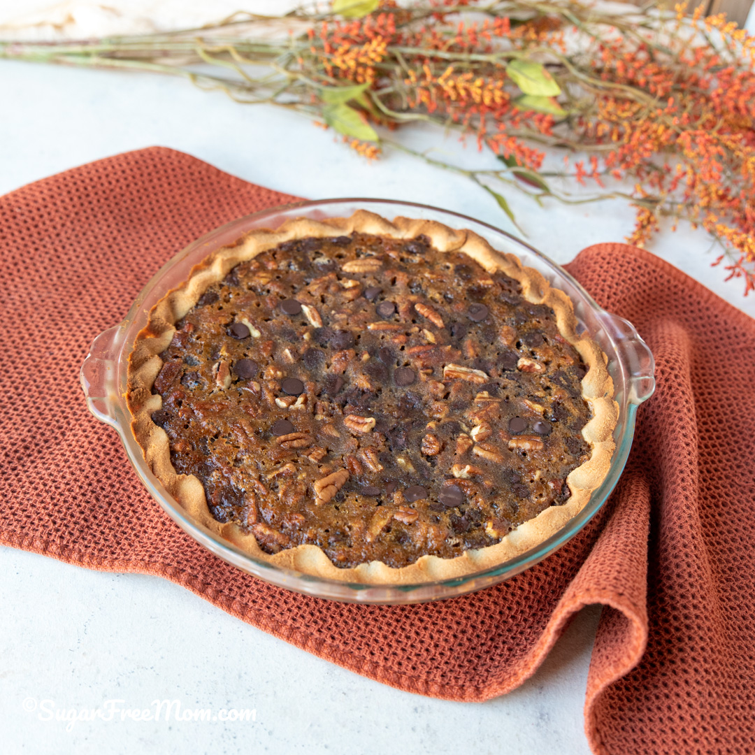 This easy keto Kentucky derby pie has a delicious gooey chocolate pecan filling baked in a flaky easy keto pie crust. Just 4 g net carbs per serving! 